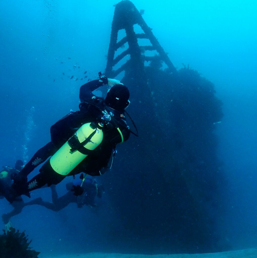 Diver at the bow of the Rainbow Warrior wreck
